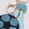 A blue diamond-encrusted football-shaped keychain with a light green braided rope handle Application Scenario